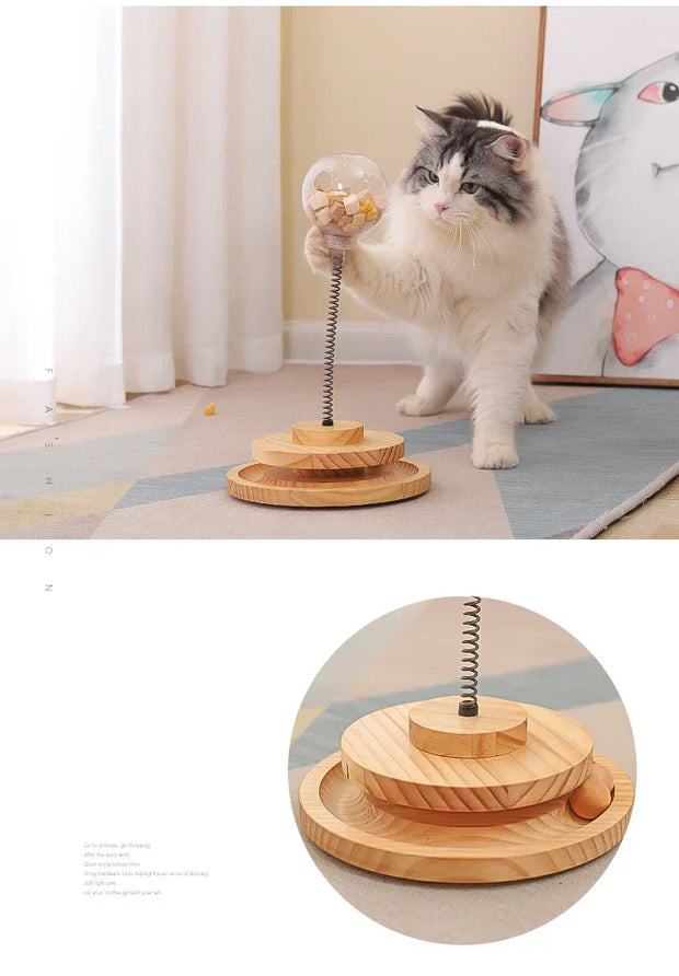 Interactive cat turntable made of solid wood, featuring a spring-loaded design for stimulating play and feeding.