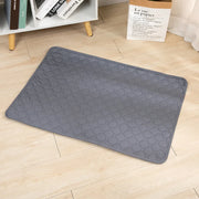 EcoComfort Washable Pee Pad & Pet Blanket on wooden floor, eco-friendly and absorbent.