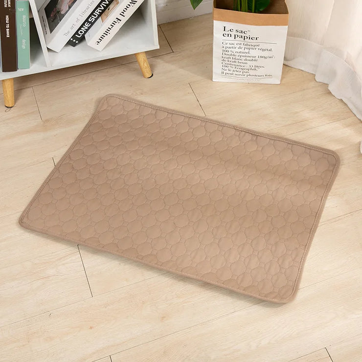 EcoComfort Washable Pee Pad on wooden floor, eco-friendly pet care solution.